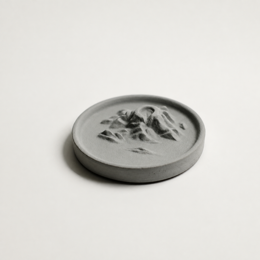 Grey Yunyu Island concrete backflow incense burner on a light background