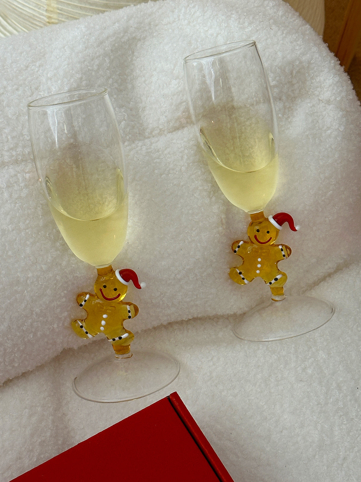 Amber glass gingerbread character detail on a champagne glass stem