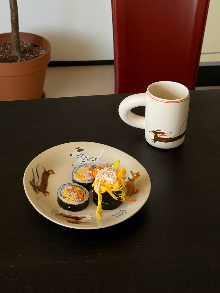 SoftServe character ceramic mug beside a brunch plate and iced coffee