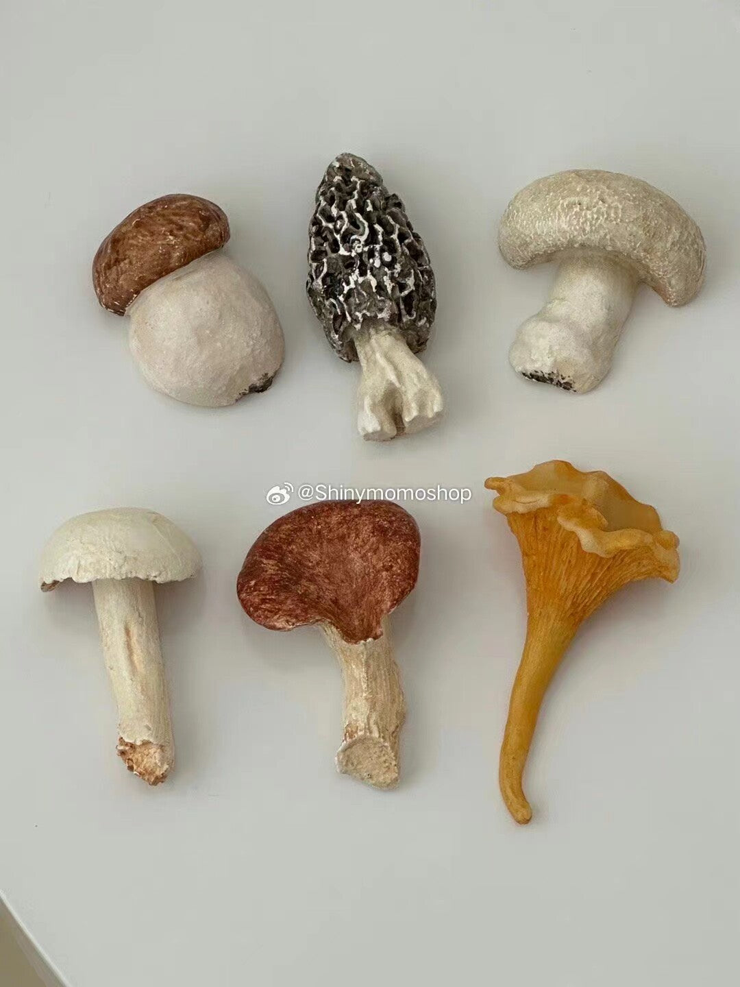 Flat lay of six sculptural mushroom cutlery rests