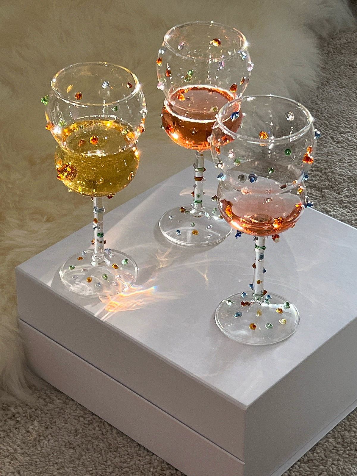 Hand-applied colorful glass dots on a Shinymomo wine glass