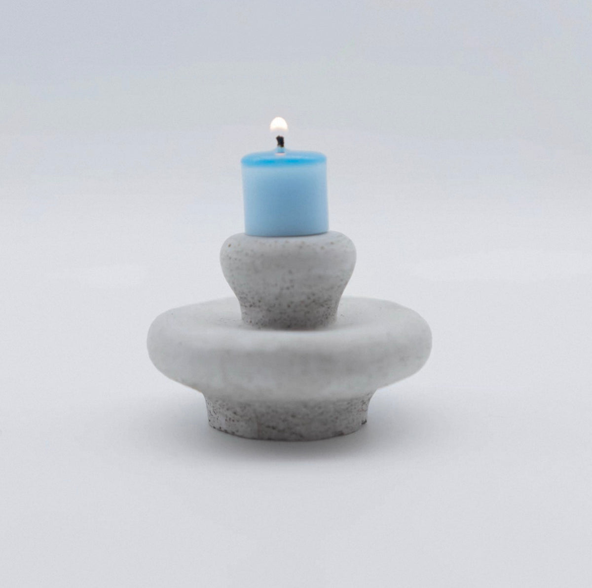 Moon Spring mini sculptural candle unlit on a soft white background