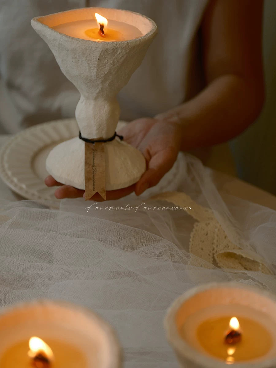 Holy Grail incense scented candle styled in a warm interior