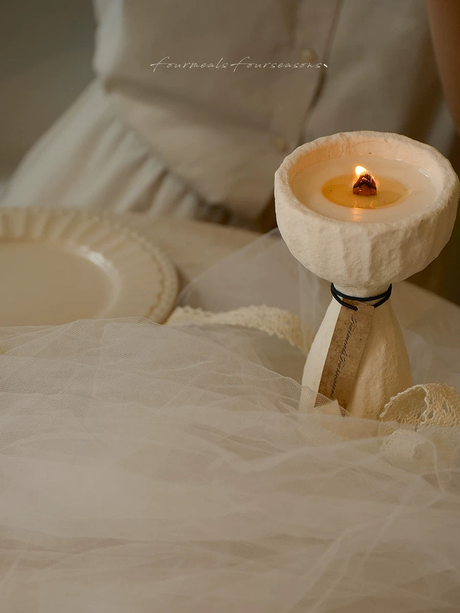 Textured cement candle in a quiet lifestyle setting