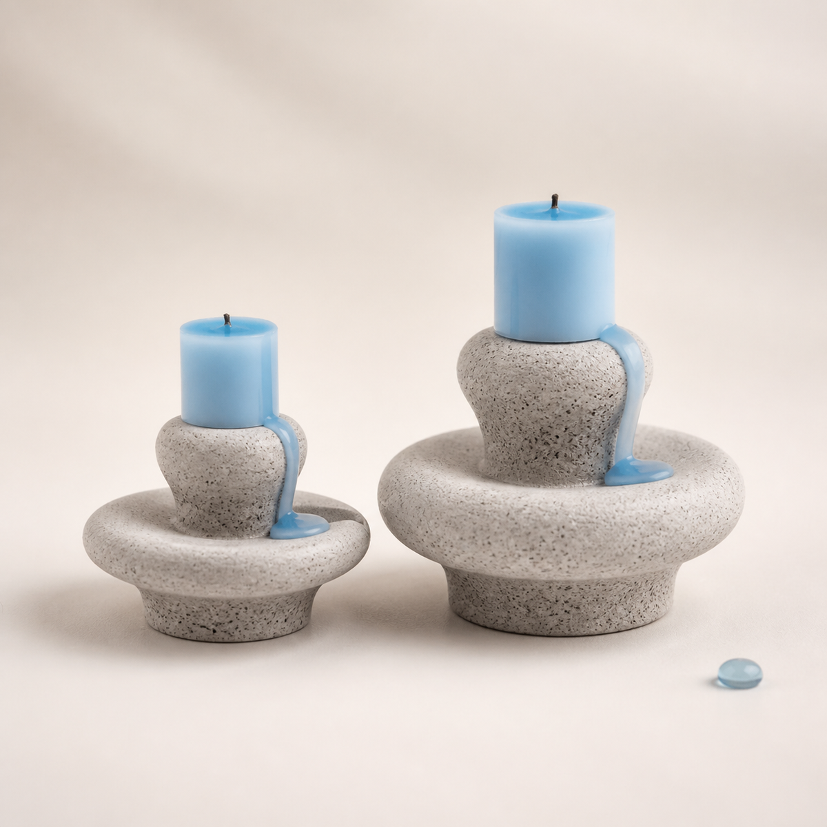 Mini and standard Moon Spring sculptural candles on a warm white background