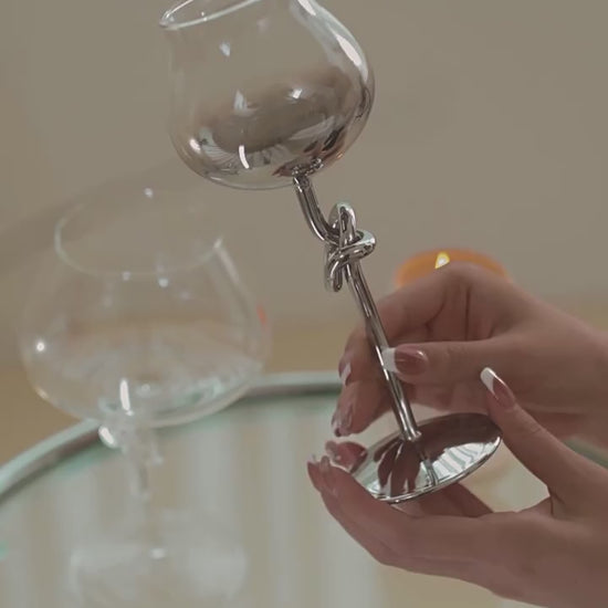 Video showing the On A Manner knot-stem wine glass collection