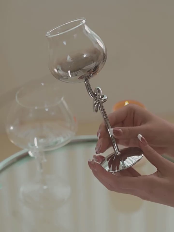 Video showing the On A Manner knot-stem wine glass collection