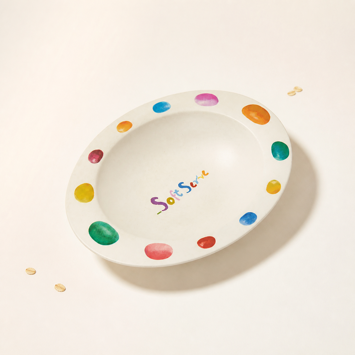Colorful candy bean bamboo-fiber bowl on a warm white background