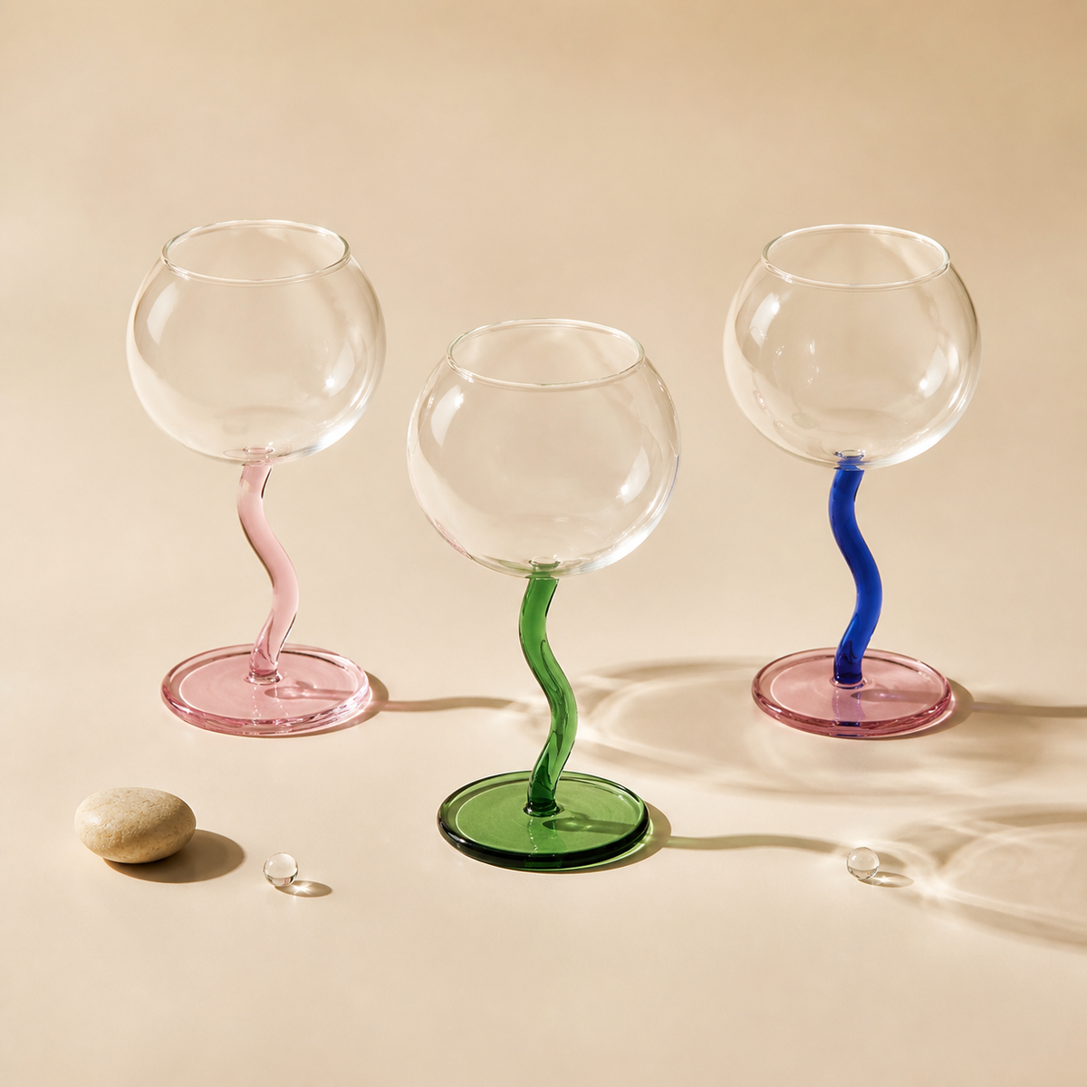 SOREMO Bubble colored glass goblet collection on a warm ivory background