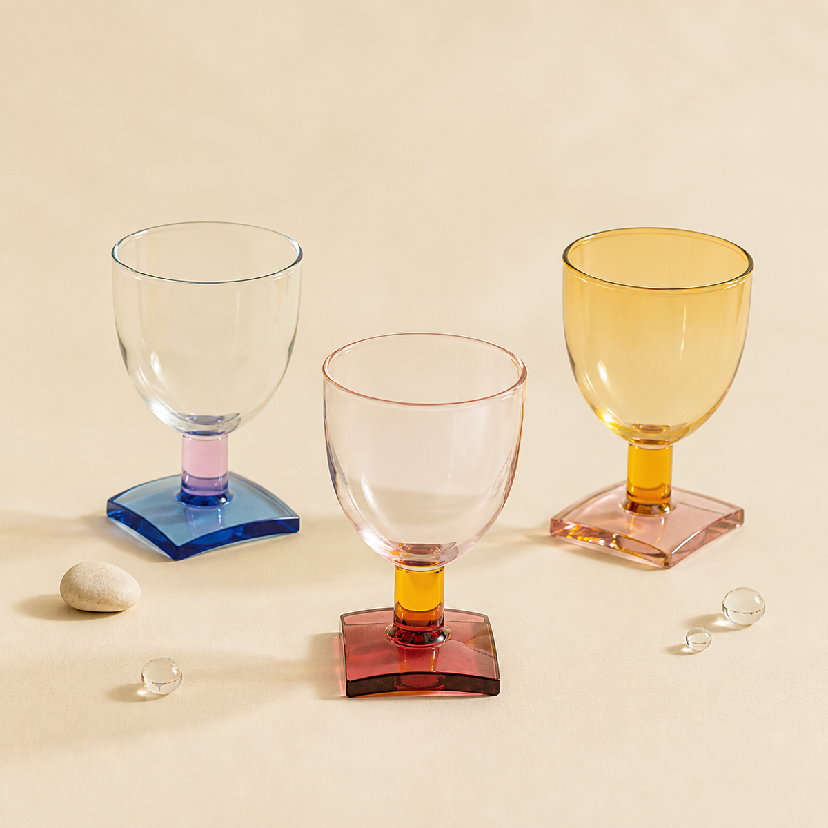 SOREMO Sugar Cube colored glass goblets on a warm ivory background