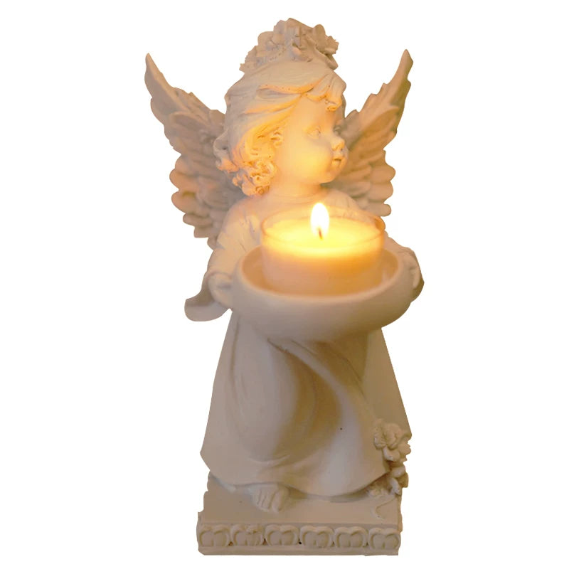 White angel tealight candle holder on a white background